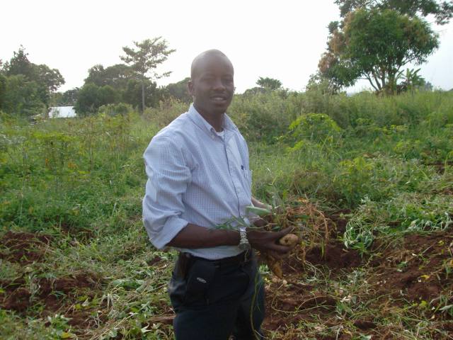 hpim03121 Mark, standng on his land in Uganda
