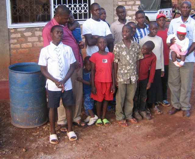 John with orphans who live at his home John with some of the orphans who live at his home (John is in the red shirt at left)