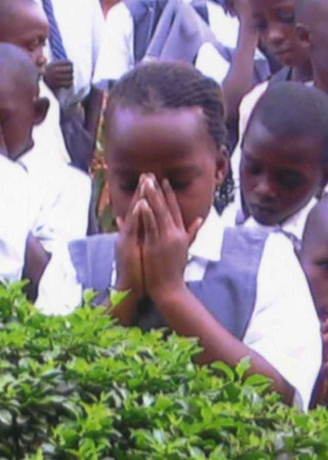 Praying girl at Nkumba Praying girl at Nkumba